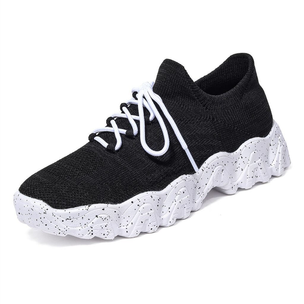 Model 5701 black and white knit lace-up sneaker, full three-quarter product view
